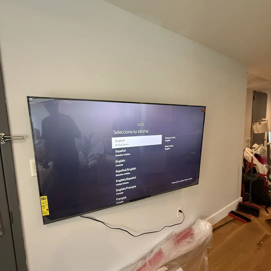 75 inch TV wall mounted in a narrow NYC apartment hallway