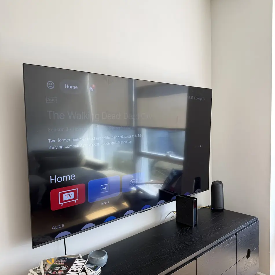 Large flat-screen TV wall mounted flush in a New York living room
